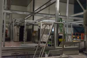 New killing/processing building containing giant gas chamber - Under construction at time of photos (2015). Gondolas much larger to gas many more pigs at once. Side of chamber opens, wall closes in to push pigs into gondola. - Captured at JBS Pork Australia (formerly Diamond Valley Pork), Laverton North VIC Australia.