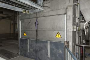 New killing/processing building containing giant gas chamber - Under construction at time of photos (2015). Gondolas much larger to gas many more pigs at once. Side of chamber opens, wall closes in to push pigs into gondola. - Captured at JBS Pork Australia (formerly Diamond Valley Pork), Laverton North VIC Australia.