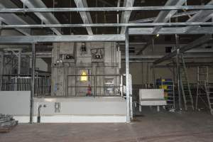 New killing/processing building containing giant gas chamber - Under construction at time of photos (2015). Gondolas much larger to gas many more pigs at once. Side of chamber opens, wall closes in to push pigs into gondola. - Captured at JBS Pork Australia (formerly Diamond Valley Pork), Laverton North VIC Australia.