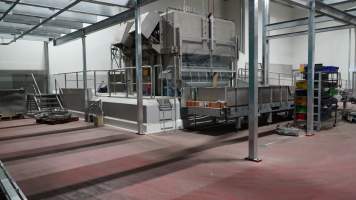 New killing/processing building containing giant gas chamber - Under construction at time of photos (2015). Gondolas much larger to gas many more pigs at once. Side of chamber opens, wall closes in to push pigs into gondola. - Captured at JBS Pork Australia (formerly Diamond Valley Pork), Laverton North VIC Australia.