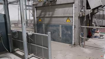 New killing/processing building containing giant gas chamber - Under construction at time of photos (2015). Gondolas much larger to gas many more pigs at once. Side of chamber opens, wall closes in to push pigs into gondola. - Captured at JBS Pork Australia (formerly Diamond Valley Pork), Laverton North VIC Australia.