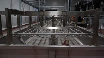 New killing/processing building containing large long scalding tank - Under construction at time of photos (2015). Gondolas much larger to gas many more pigs at once. Side of chamber opens, wall closes in to push pigs into gondola. - Captured at JBS Pork Australia (formerly Diamond Valley Pork), Laverton North VIC Australia.