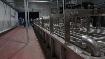 New killing/processing building containing large long scalding tank - Under construction at time of photos (2015). Gondolas much larger to gas many more pigs at once. Side of chamber opens, wall closes in to push pigs into gondola. - Captured at JBS Pork Australia (formerly Diamond Valley Pork), Laverton North VIC Australia.