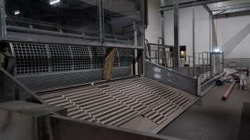 New killing/processing building containing giant gas chamber - Under construction at time of photos (2015). Gondolas much larger to gas many more pigs at once. Side of chamber opens, wall closes in to push pigs into gondola. - Captured at JBS Pork Australia (formerly Diamond Valley Pork), Laverton North VIC Australia.