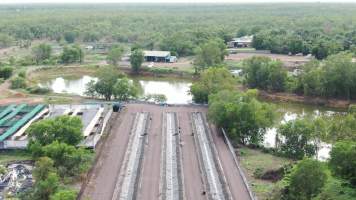 Cages at hidden Crocodylus crocodile farm - Drone flyover - Captured at Crocodylus Park Farm & Abattoir, Knuckey Lagoon NT Australia.