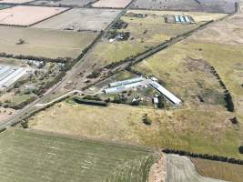 Drone flyover of free-range egg farm - Layer hens seen outside - Captured at Free-range egg farm (Peter & Cheryl King), Lethbridge VIC Australia.