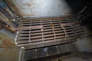 Top view of gondolas and walkway - A top view of gondolas and walkway in a Butina backloader gas chamber - Captured at JBS Pork Australia (formerly Diamond Valley Pork), Laverton North VIC Australia.
