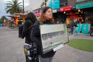 5 Question Challenge: Dominion Outreach Melbourne: 15 June 2025 - Animal rights activists participating in a street outreach event in St Kilda, Victoria, Australia. Some volunteers hold placards inviting pedestrians to answer 5 questions in exchange for a vegan treat. Others hold TVs showing footage from Farm Transparency Project's dairy investigations. Together, they bring awareness to the hidden reality of what happens to cows, calves, and bulls in the Australian dairy industry. - Captured at VIC.