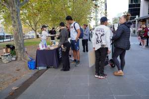 Mother's Day: Dominion Outreach Melbourne: 11 May 2025 - Animal rights activists participating in a street outreach event in Southbank, Victoria, Australia. Volunteers give out free vegan treats, show footage from Farm Transparency Project's dairy investigations, and engage the public in conversations, bringing awareness to the hidden reality of what happens to cows, calves, and bulls in the Australian dairy industry. - Captured at VIC.