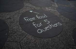 5 Question Challenge: Dominion Outreach Melbourne: 15 June 2025 - Animal rights activists participating in a street outreach event in St Kilda, Victoria, Australia. Some volunteers hold placards inviting pedestrians to answer 5 questions in exchange for a vegan treat. Others hold TVs showing footage from Farm Transparency Project's dairy investigations. Together, they bring awareness to the hidden reality of what happens to cows, calves, and bulls in the Australian dairy industry. - Captured at VIC.
