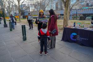 22 June 2025: 5 Question Challenge: Dominion Outreach Melbourne - Animal rights activists participating in a street outreach event in Southbank, Victoria, Australia. Some volunteers hold placards inviting pedestrians to answer 5 questions in exchange for a vegan treat. Others hold TVs showing footage from Farm Transparency Project's dairy investigations. Together, they bring awareness to the hidden reality of what happens to cows, calves, and bulls in the Australian dairy industry. - Captured at VIC.