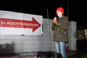 Cedar Meats Vigil - National Week Of Action 2025 - During the Shut Down Slaughterhouses Week of Action, we held a vigil outside of the Cedar Meats slaughterhouse in Brooklyn, Victoria.
During a two week investigation last year, our hidden cameras captured the handling and slaughter of animals, including newborn lambs and kids born in the holding pens of the slaughterhouse.
It was a Wednesday night when we gathered outside the slaughterhouse, holding signs and listening to music and speeches from investigators. We wanted to send a message to Cedar Meats, to let them know that we have not forgotten how they treat animals when they believe that no one is watching
We poured fake blood across their driveway as a visual reminder to everyone passing by, that animals arriving here are coming to their deaths. At the gates to the slaughterhouse, we each left a flower.
The images of animals whose deaths we have seen will haunt us forever, but we are determined to continue to fight in their name. - Captured at Cedar Meats, Brooklyn VIC Australia.