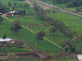 Drone flyover - Drone flyover of unknown dairy showing calf sheds and milking shed. - Captured at Unnamed Devondale Dairy, Woods Point SA Australia.