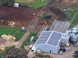 Drone flyover - Drone flyover of unknown dairy showing calf sheds and milking shed. - Captured at Unnamed Devondale Dairy, Woods Point SA Australia.