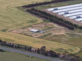 Drone flyover of broiler (meat) chicken farm - Captured at Pavilion Farm 6, Anakie VIC Australia.