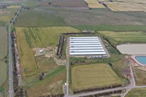 Drone flyover of broiler (meat) chicken farm - Captured at Pavilion Farm 6, Anakie VIC Australia.